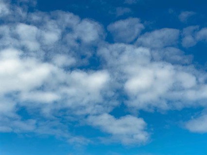 Medium-high white clouds Altocumulus Sheep clouds in good weather on a blue sky, international