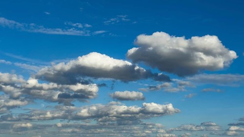 Cloud field of elongated Stratocumulus in front of a blue sky, international