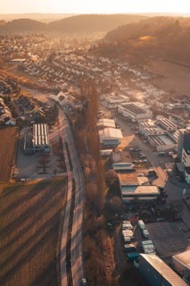 Industrial Landscape at Twilight with Roads and Houses nestled in Hilly Terrain, Aidlingen,