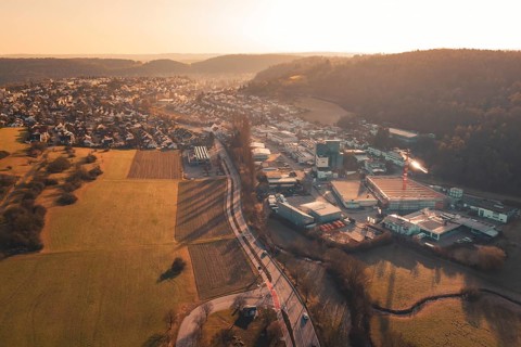 Aerial view of urban and industrial areas transitioning into countryside, Aidlingen, Böblingen