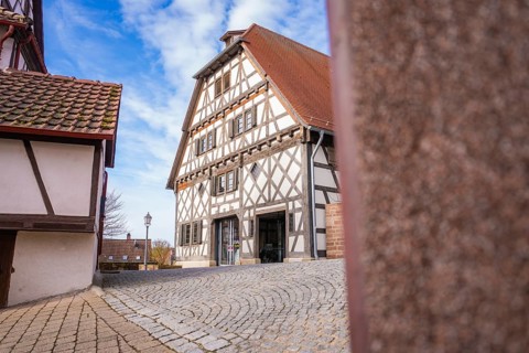 Timbered house and cobblestone street in a quiet historic village, Ötisheim, Enzkreis, Germany