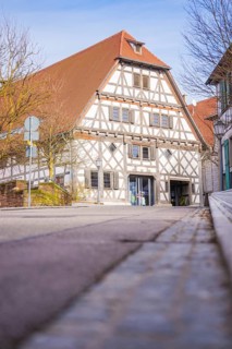 Historic half-timbered house on a quiet street in sunny spring weather, Ötisheim, Enzkreis, Germany