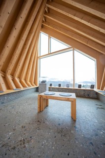 Modern interior with wooden elements and large window showing nature, Sinnraum, Oberreute, Allgäu,