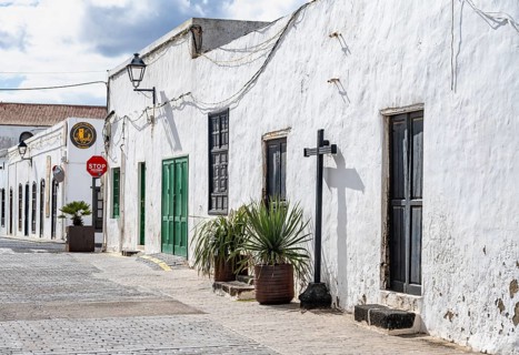 Typical white houses with colored doors and windows in an alley, Teguise, Lanzarote, Canary
