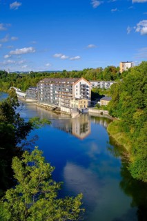 Old renovated spinning mill and dam, hydroelectric power plant on the Iller, Kempten, Oberallgäu,