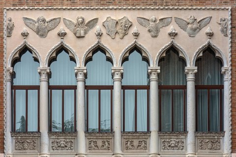 Decorative window front with reliefs of a palazzo, Venice, Veneto, Italy