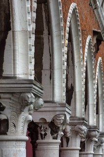 Arcades with figure capitals, from the historic market of Rialto, Venice, Veneto, Italy