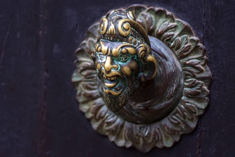 Fantasy male figure as doorknob, Venice, Veneto, Italy