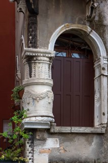 Decorative columns at the entrance of a palazzo, Venice, Veneto, Italy