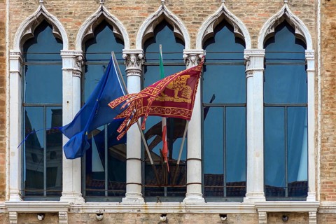 Waving flags of Europe and the Republic of Venice at Palazzo Zaguri, Venice, Venice, Italy