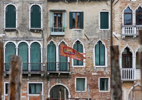 Waving flag of the Republic of Venice on a residential building, Venice, Venice, Italy
