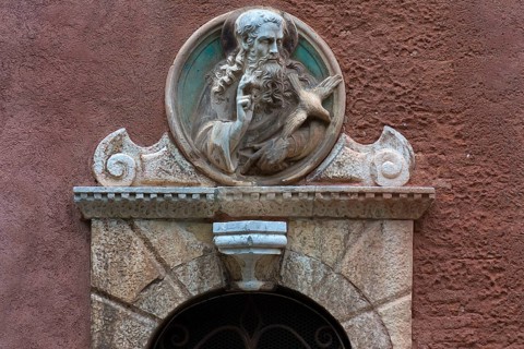 God the Father sculpture with a dove over a gate, Venice, Veneto, Italy