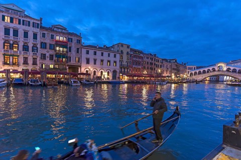 Grand Canal with Rialto Bridge in the evening, gondola in front, Venice, Veneto, Italy