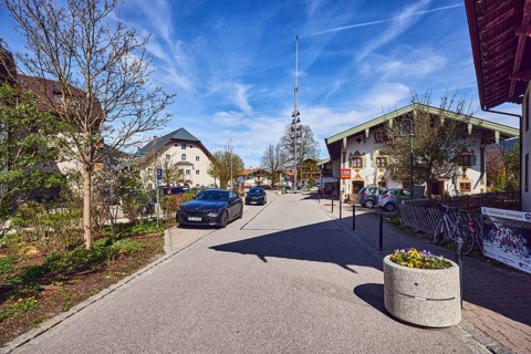 Maypole, alpine buildings, general architecture, houses, barrier bollards, flower pots, parking