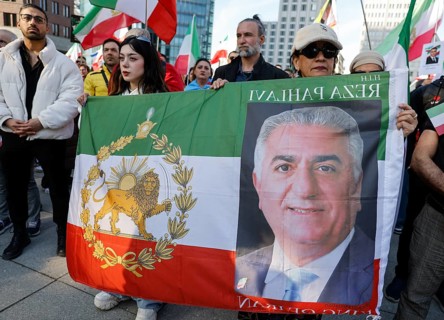 Iranians demonstrate with a poster of Prince Reza Pahlavi on the day of the US and Israeli attack
