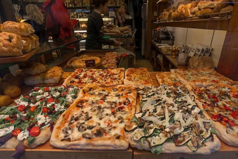 Different pizzas in a window display, Venice, Veneto, Italy