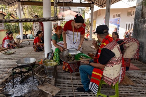 Mising people having traditional food during Ali-Aye-Ligang festival in Guwahati, Assam, India on