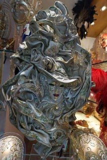 Shop window with an elaborate Venician carnival mask, Venice, Veneto, Italy