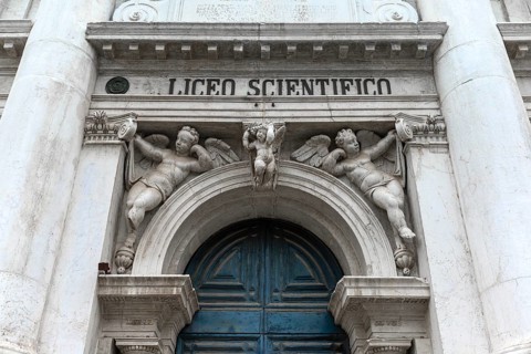 Entrance portal with angel sculptures from the University of Science, Venice, Veneto, Italy