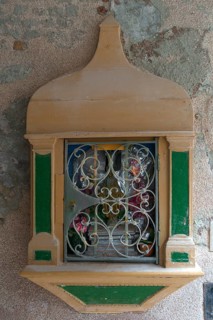 Holy shrine with the figure of Jesus Christ on a house wall, Venice, Veneto, Italy