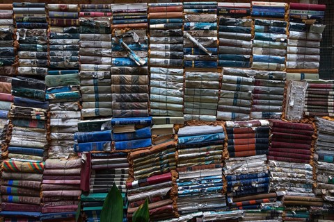 Stacked books after flood damage in a bookstore, Venice, Veneto, Italy