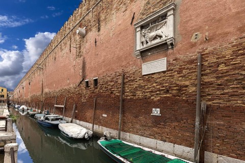 Historic wall from the Arsenal, relief with the heraldic animal of the Venetian lion, Venice,