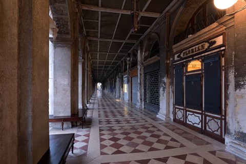 Empty arcades of the Old Procuration, 16th century, St. Mark's Square early in the morning Venice,