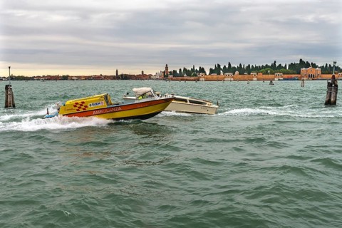 Venetian ambulance in action, San Michele cemetery in the back, Venice, Veneto, Italy
