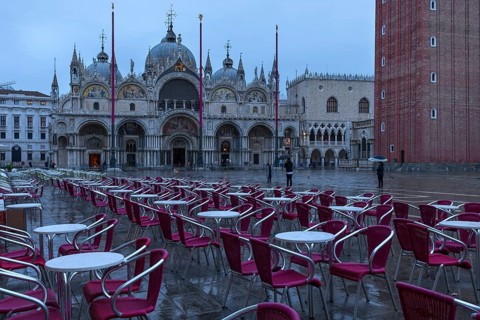 Empty St. Mark's Square with St. Mark's Basilica early in the morning in rainy weather, Venice,
