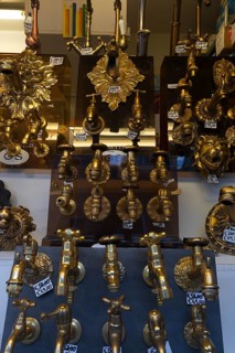 Shop window with gold-colored faucets, Venice, Veneto, Italy
