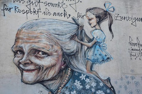 Mural from Herakut 2015, old woman with girl hairdressing her long hair, cosmetics, saying, face,