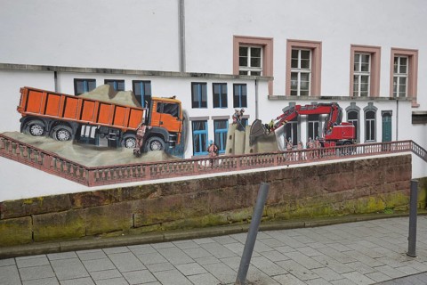 Mural construction by Jaune 2020, alleyway art, graffiti, excavator, dump truck, construction site,