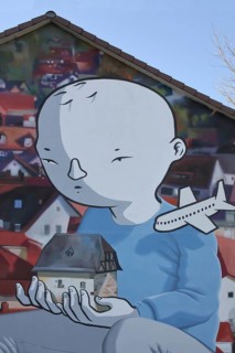 Mural by CASE MacAclaim and Millo, street art, graffiti, child carrying house in hands,