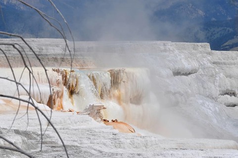 White volcanic deposits, rock formation with steaming waterfall, Yellowstone National Park,