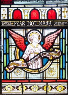Details of stained glass window of an angel by Clayton and Bell, church of Saint James, Avebury,