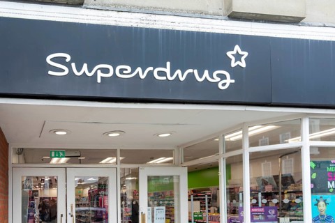 Sign and logo above shop entrance, Superdrug, Beccles, Suffolk, England, UK