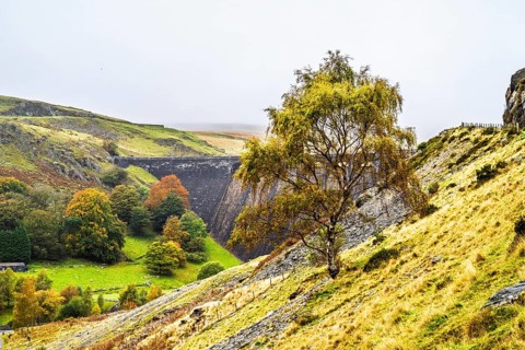 Autumn colors over Claerwen Dam, Claerwen Valley, Elan Valley Reservoir, Rhayader, Powys, Wales, UK
