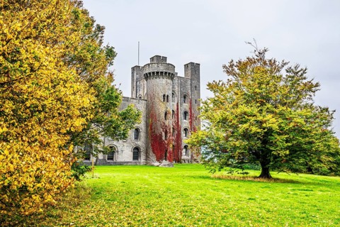 Autumn colors over Penrhyn Castle and Garden, Llandygai, Bangor, Gwynedd, North Wales, UK
