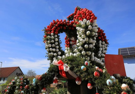 Detail of an Easter fountain in Franconian colors red and white, Franconian Switzerland, in