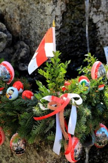 Detail of an Easter fountain in Franconian colors red and white, Franconian Switzerland, in