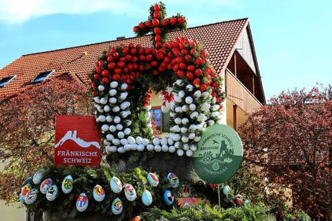 Detail of an Easter fountain in Franconian colors red and white, Franconian Switzerland, in