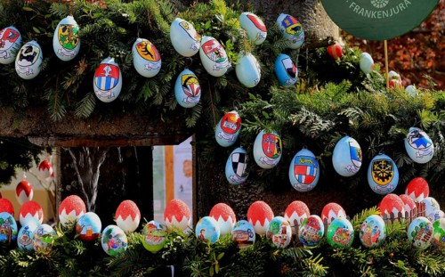 Detail of an Easter fountain in Franconian colors red and white, eggs with coats of arms of the