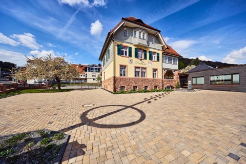 Town hall, commercial building, general architecture, shade of a maypole, hill, coniferous forest,