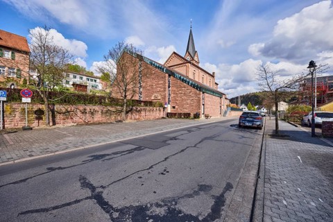 St. Michael church, sandstone wall, general architecture, houses, lantern, parking strips with car,