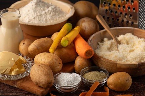 Flour and milk in addition to potatoes, parmesan and carrots