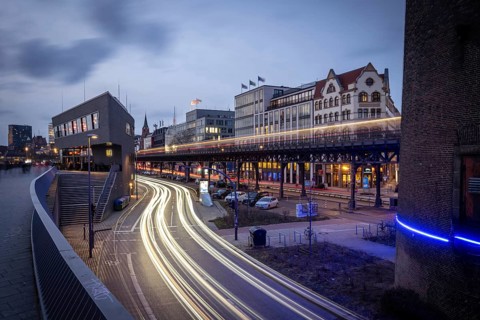 Café ALEX Hamburg Überseebrücke an den Landungsbrücke at the Blue Hour with light strips from
