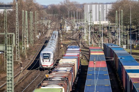 ICE long-distance train, on the line, container trains in the freight yard, so-called installation