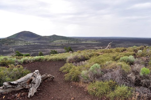 Trail leads through barren, hilly lava landscape, Craters of the Moon National Monument, Idaho, USA