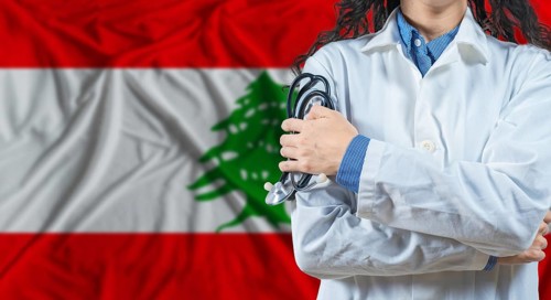 Healthcare professional with Lebanon flag background. Professional doctor holding stethoscope on