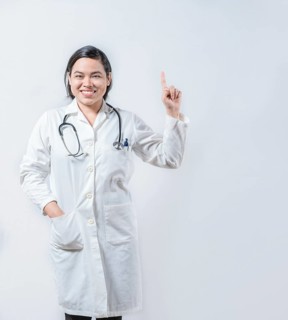 Young asian doctor recommending an advertisement. Asian female doctor pointing up isolated